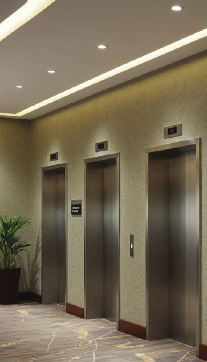 Modern elevator lobby with stainless steel lift doors